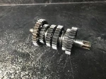 85-87 Kawasaki Output Shaft Assembly # 13128-1115 125 Stroke KX2. Fixed Price $59.95.
